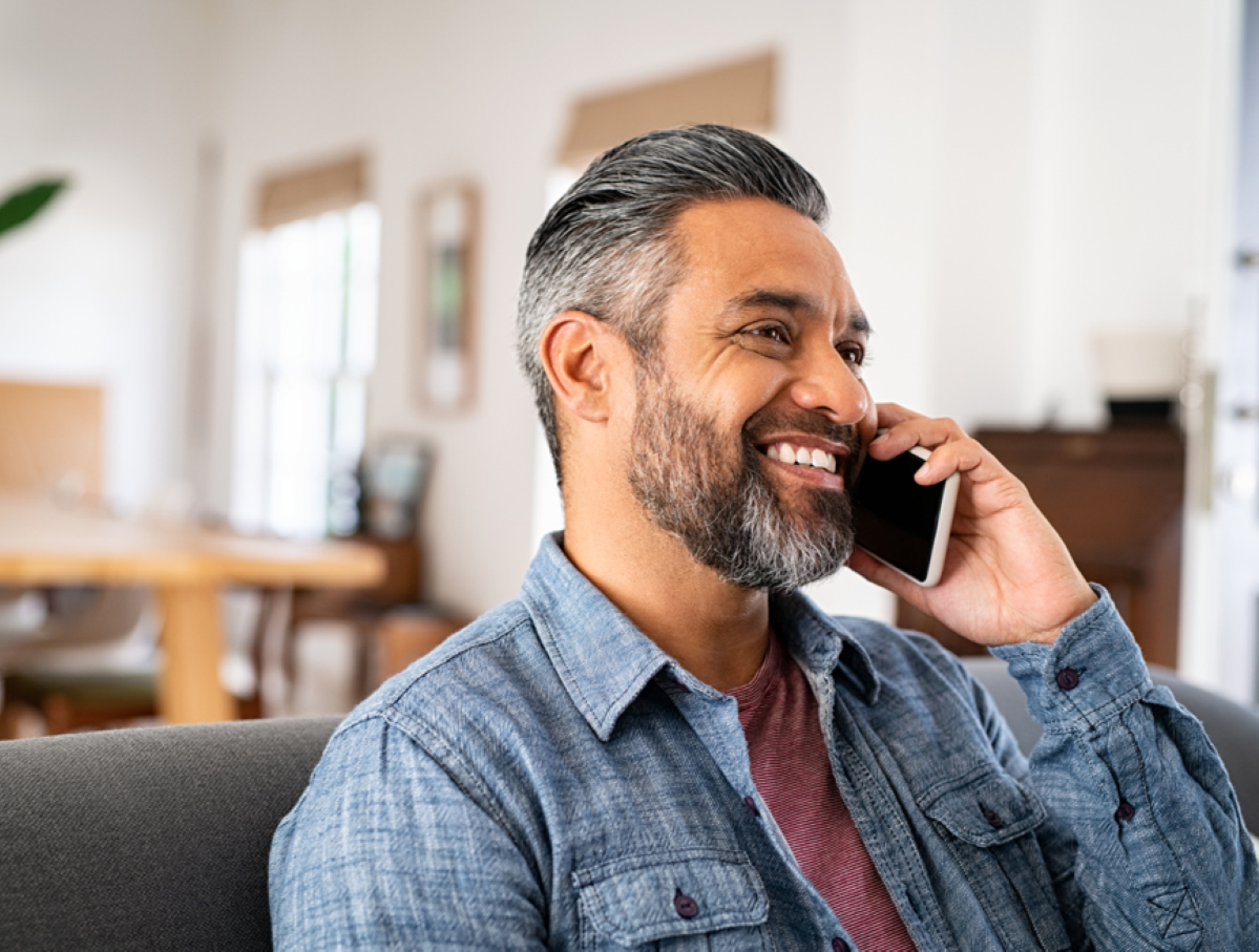 A client at home engaging in a phone counselling session for individuals, couples, or families, NDIS or EAP support