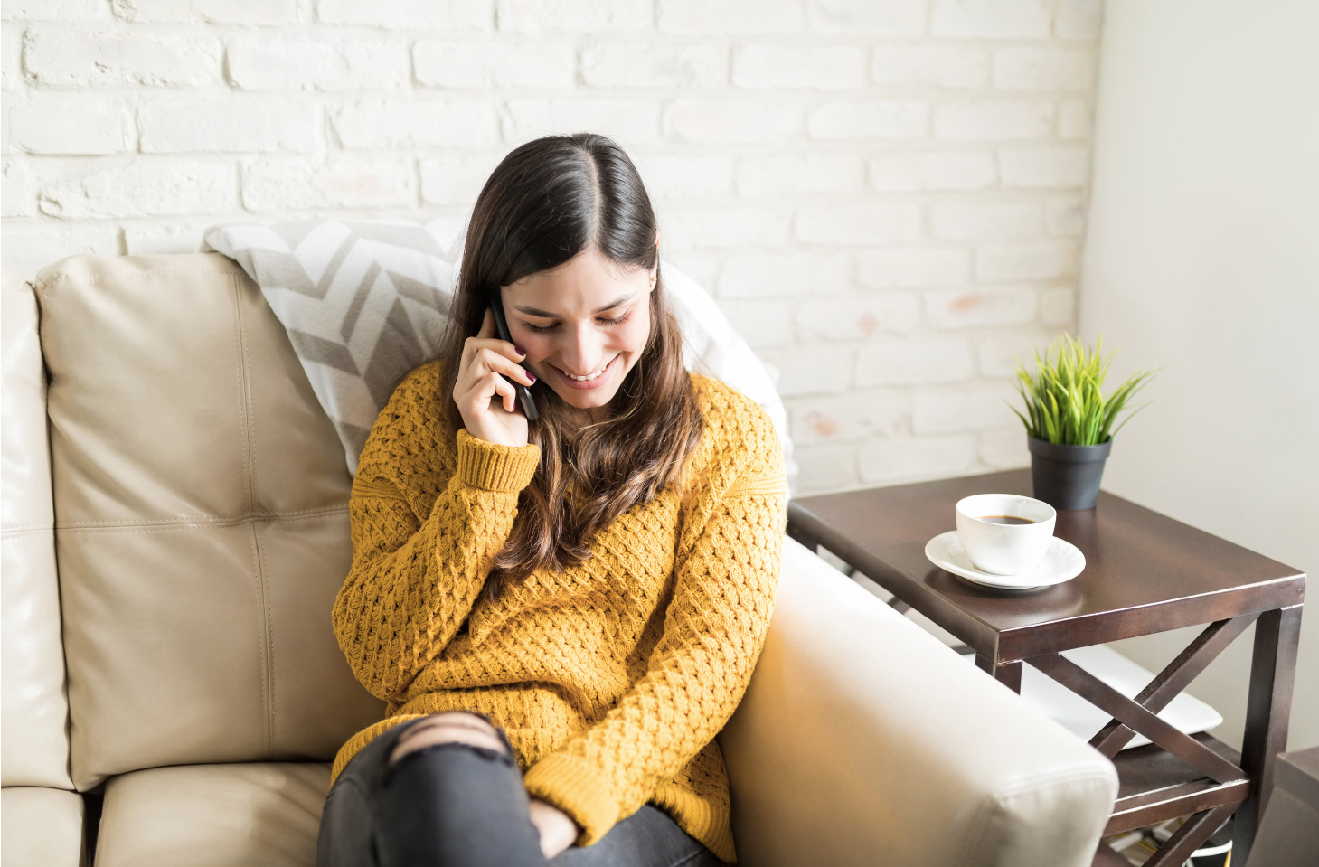christian-counselling-phone-session-respecting-client-preferences Woman speaking on phone during Christian counselling session, reflecting a respectful and client-led approach