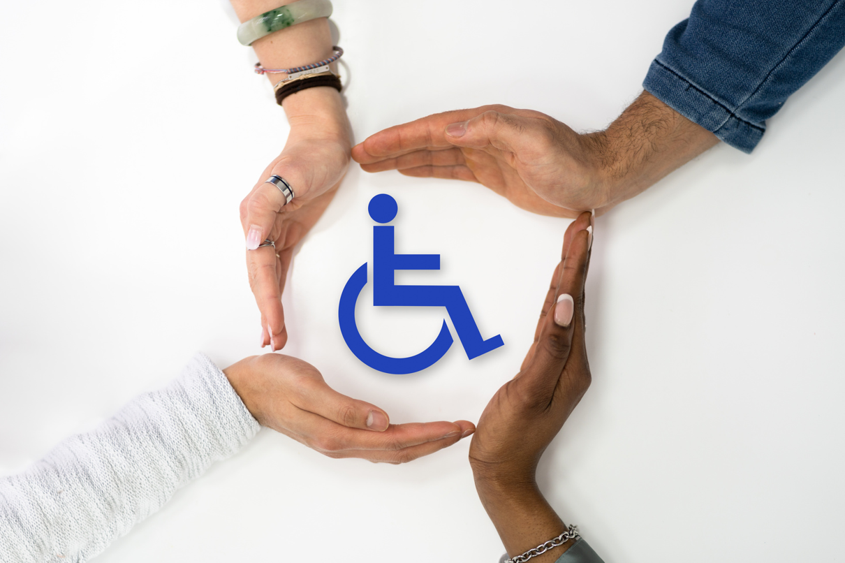 ndis-online-counselling-support-australia Four diverse hands forming a protective circle around a blue wheelchair disability symbol on a white background, representing inclusive NDIS counselling support