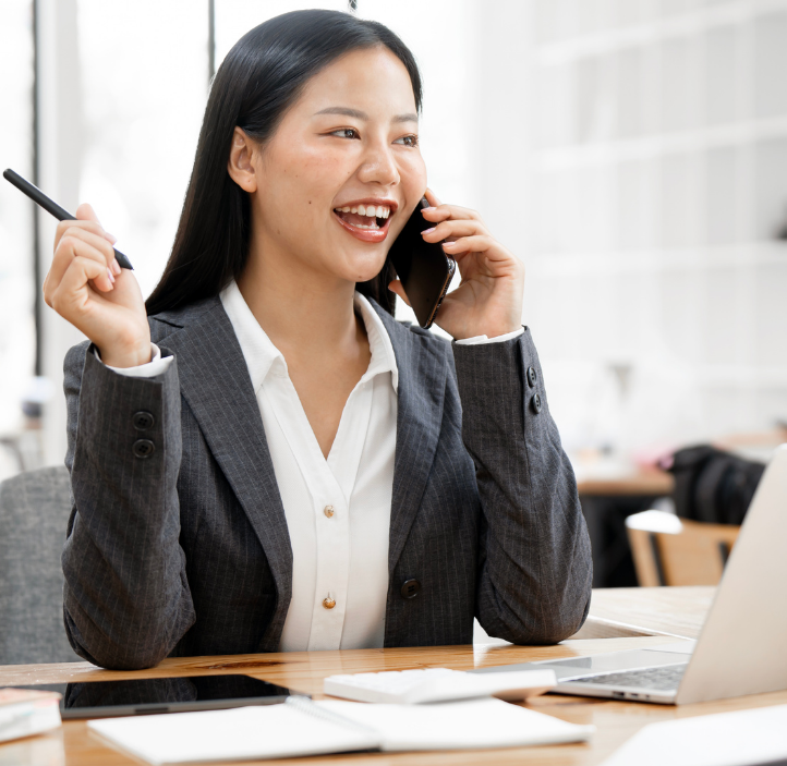 HR manager contacting employee assistance program provider on phone and laptop