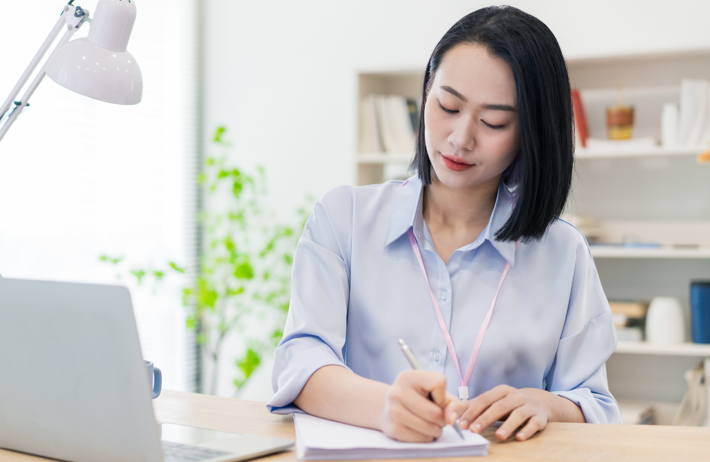 professional writing notes during non-clinical supervision reflection