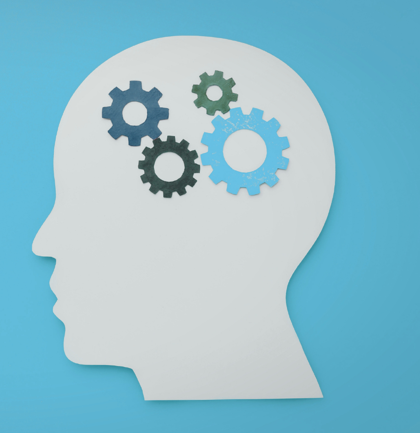 Side profile silhouette of a human head with interlocking gears inside representing cognitive behavioural therapy and thought processes