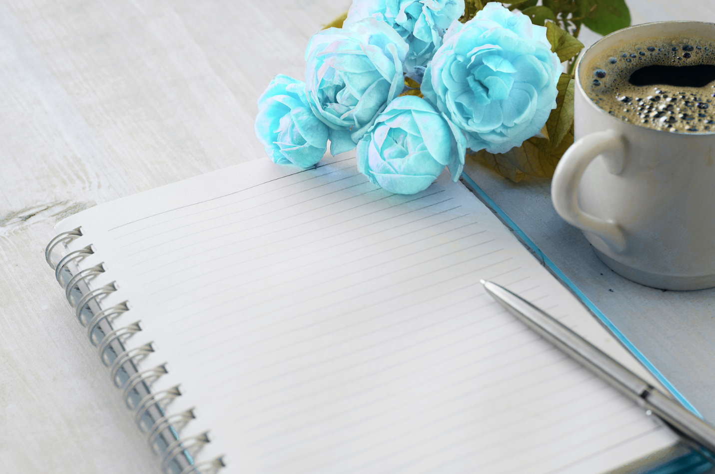 policies-counselling-supervision-australia A clean workspace with a notepad, pen, and coffee, representing the professional documentation and privacy of SCSS